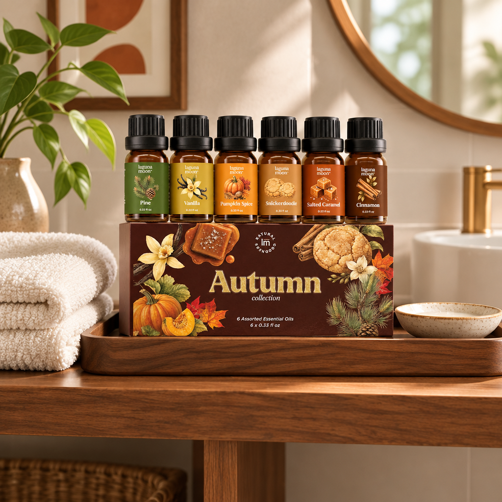 Set of six autumn scented essential oil bottles in a gift box on a wooden tray in a warm bathroom